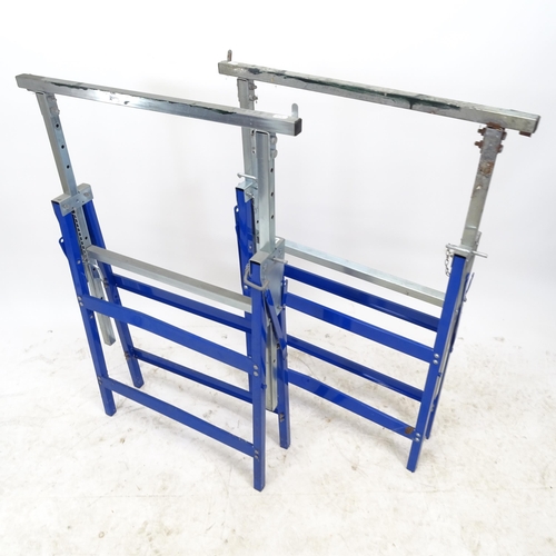 2618 - A pair of adjustable metal trestle table legs