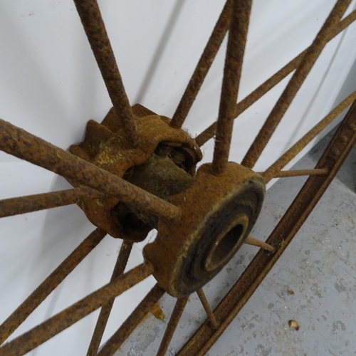 2633 - An Antique cast-iron carriage wheel, D141cm