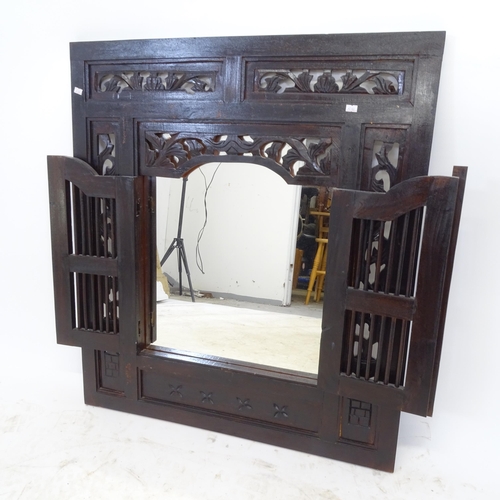 2652 - A wooden-framed wall mirror, in the form a shuttered window, with carved and pierced decoration, W58... 