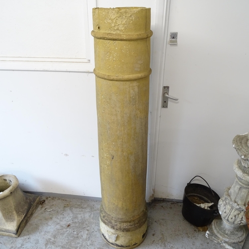 2658 - A tall terracotta chimney pot, H153cm