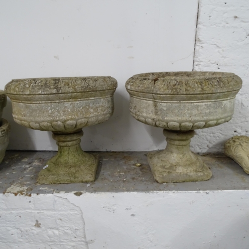 2665 - A pair of weathered concrete garden urns on stands, D44cm, H42cm