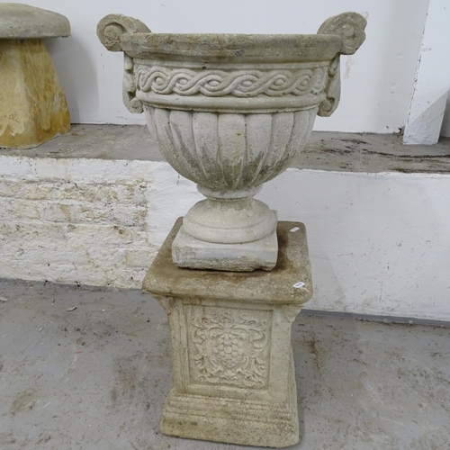 2672 - A weathered concrete 2-handled garden urn, W46cm, H43cm, and a square weathered concrete pedestal, W... 