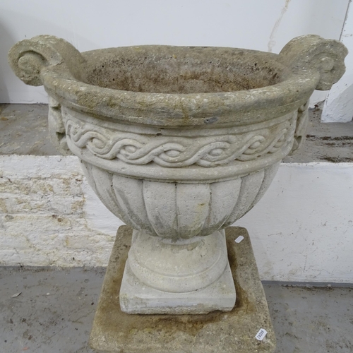 2672 - A weathered concrete 2-handled garden urn, W46cm, H43cm, and a square weathered concrete pedestal, W... 