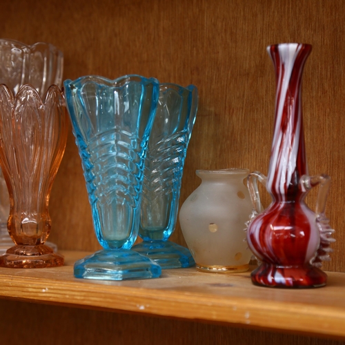 633 - A shelf of 1930s moulded glass vases, jugs etc