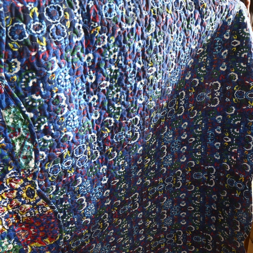 652 - A reversible machined quilt with floral design, 218cm x 196cm approx