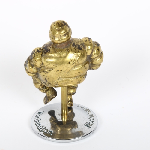 134 - A Vintage Michelin Man cast-brass car mascot, on Worthington chrome plate stand, height 11cm