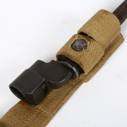 141 - A Lee Enfield no. 4 Mk II spike bayonet and scabbard, with canvas frog, spike length 19cm