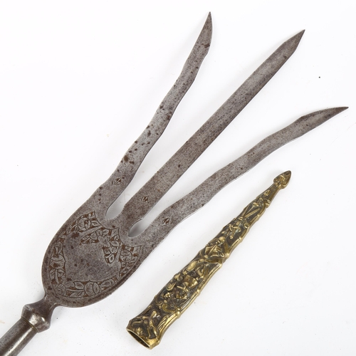 148 - A 19th century Middle Eastern steel Trident head, length 50cm, and a relief cast-brass dagger scabba... 