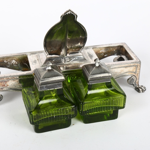 153 - An Art Nouveau electroplate desk ink stand, modelled as a dressing table, with green glass inkwells,... 