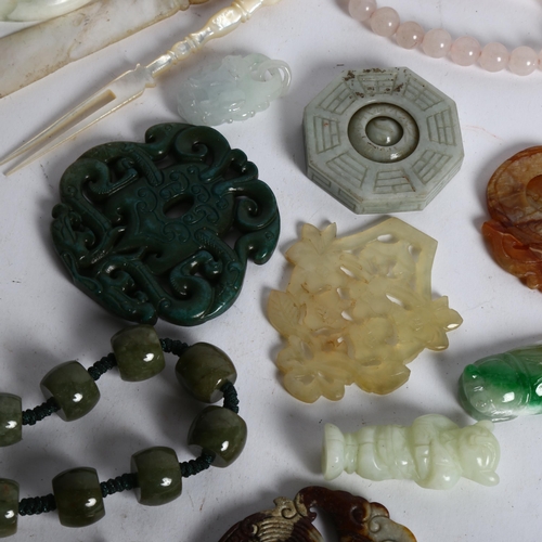 166 - A group of Oriental items, including jade bangles, Peking glass snuff bottle, beads etc