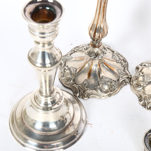 194 - A pair of Victorian silver plate on glass Rococo style candlesticks, height 25cm, and another pair (... 