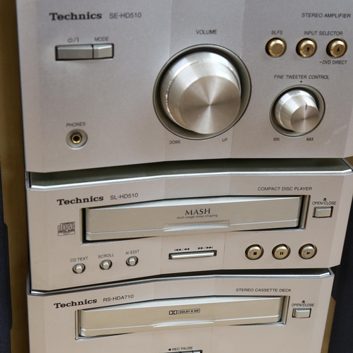 262 - A Technics stacking stereo system, with CD and tape deck, amplifier and tuner, with remote control