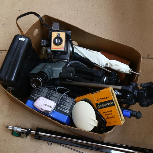 269 - A quantity of Vintage cameras and other accessories, to include 3 tripods, a Canon C-8 grip cine cam... 