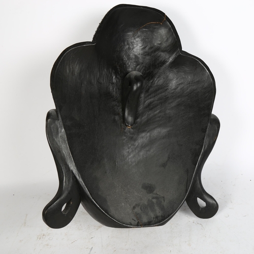 281 - A large carved and stained wood Buddha's head, height 55cm