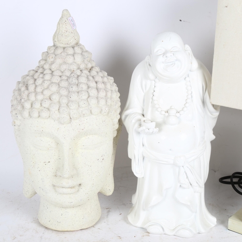 302 - A composite Buddha's head, a plaster figure of a sage, and an Oriental design table lamp and shade (... 