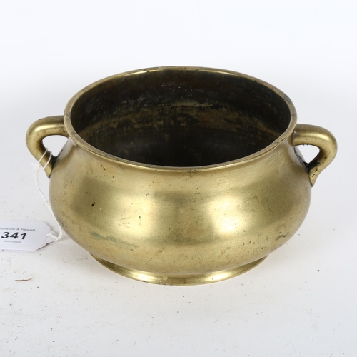 341 - A Chinese bronze censer with scrolled handles, and 6 character mark to the base, height 8.5cm