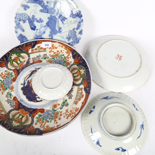 349 - A large Chinese enamelled charger, width 37cm, Canton dishes, Imari bowl etc (7)