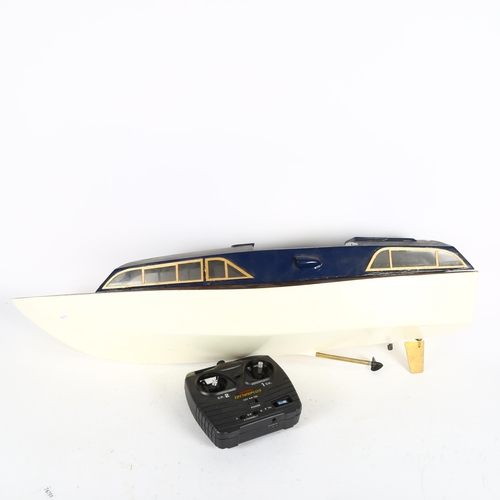 364 - A remote controlled motor launch, hull length 84cm, and an Art Deco style resin figural dancer table... 