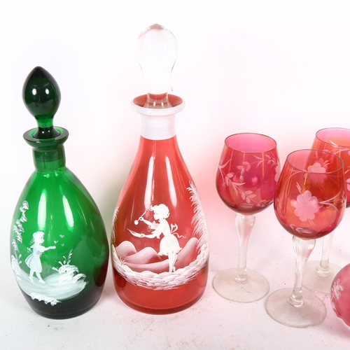 404 - Mary Gregory style cranberry glass decanter and matching jug, a Bristol green decanter, 27cm, glasse... 