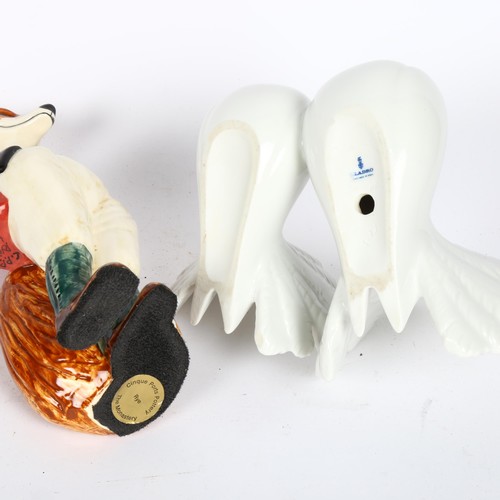 587 - A Cinque Ports Rye Pottery fox hunting figure, and a Lladro group doves (2)