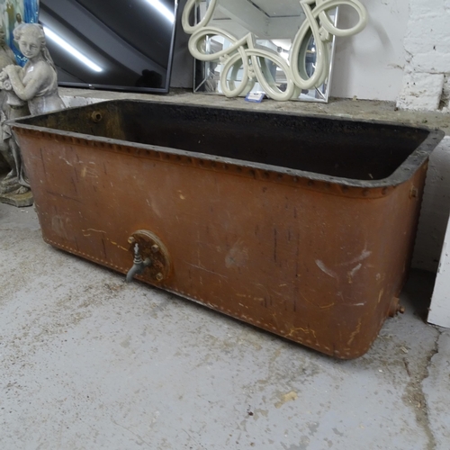 2677 - A large riveted cast-iron trough/tank with tap, L142cm, H55cm, D70cm