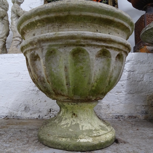 2690 - A weathered concrete circular garden urn on stand, D56cm, H55cm