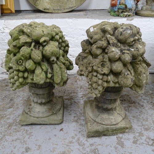 2693 - A pair of weathered concrete garden ornaments, in the form of fruit bowls, H55cm