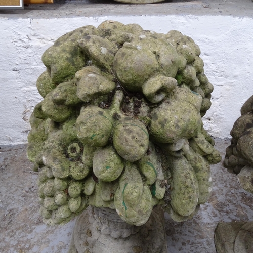 2693 - A pair of weathered concrete garden ornaments, in the form of fruit bowls, H55cm