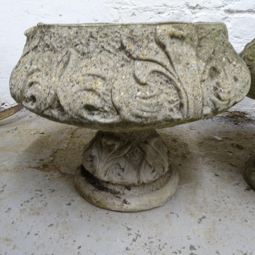 2704 - A pair of weathered concrete circular garden urns on stands, D40cm, H35cm