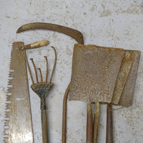 2706 - A selection of Vintage garden tools, comprising 3 shovels, a large saw, a scythe and hoe