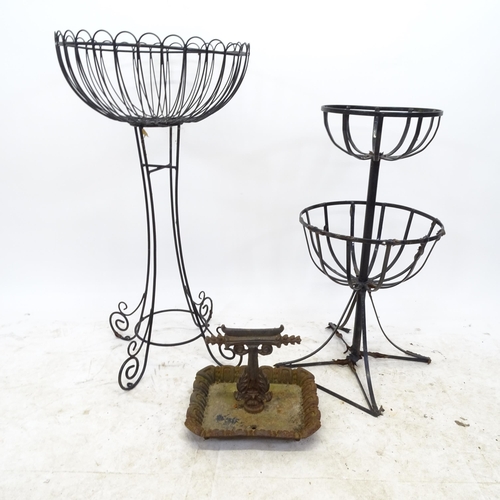 2714 - A cast iron boot scraper, a wirework plant stand and another painted metal plant stand (3)