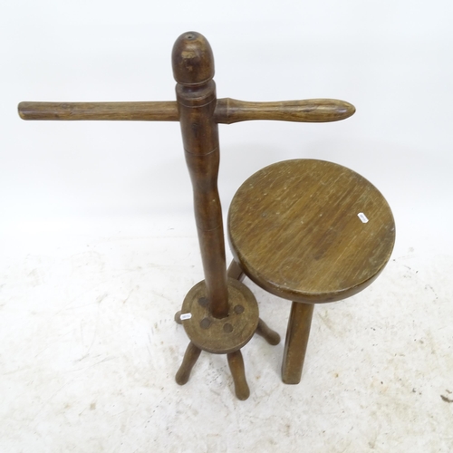 2716 - An elm milking stool, D35cm, H47cm, and a washing dolly, H92cm (2)