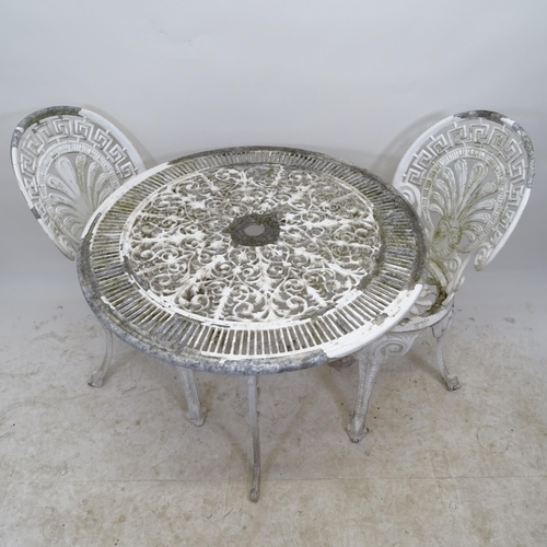 2720 - A weathered white painted metal circular-top garden table, with foliate decoration, D80cm, H69cm, an... 