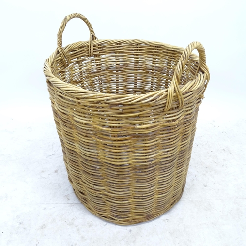 2725 - A wicker log basket, D56cm, H69cm