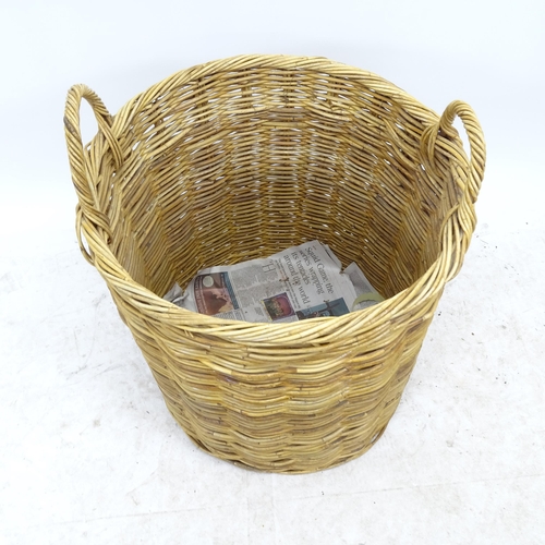 2725 - A wicker log basket, D56cm, H69cm