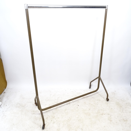 2729 - A Vintage metal shop display clothes rail on wheels, L122cm, H161cm