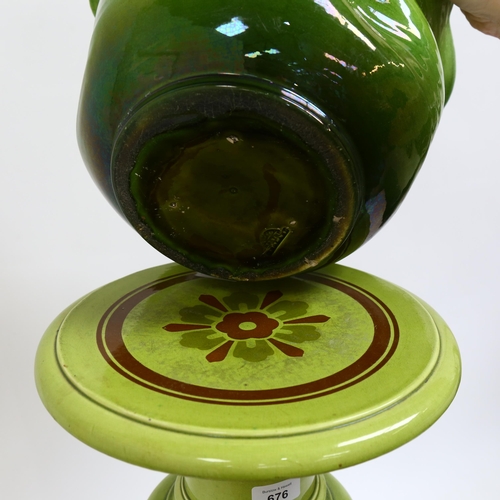 676 - An Antique Bretby green glaze pottery jardiniere and pedestal, overall height 85cm