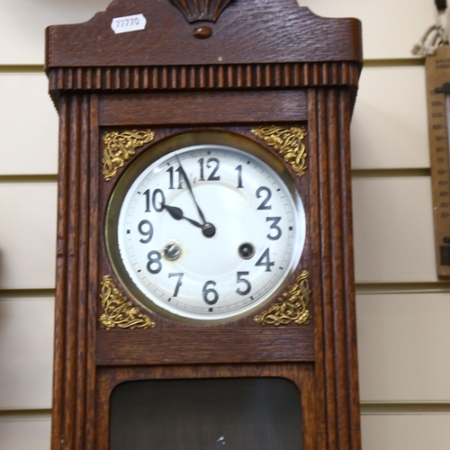 710 - A Vintage stained oak 8-day drop-dial wall clock, case height 55cm, with pendulum