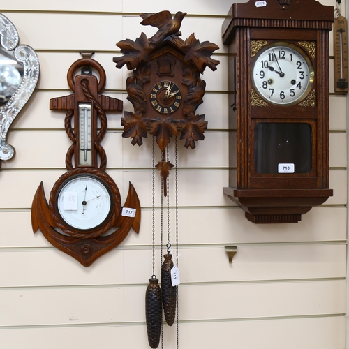 711 - A Black Forest cuckoo clock, complete with cone weights and pedulum