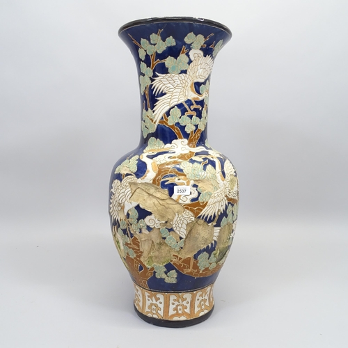 2537 - A large Chinese  blue glazed terracotta garden urn, with bird and tree decoration, H80cm