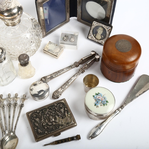 811 - A group of silver items, to include a double silver-fronted folding picture frame, a silver-topped s... 