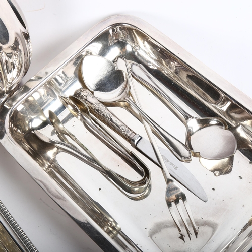 814 - An early 20th century silver plated hot water jug, a bead-edge tureen and cover, plated sugar tongs ... 