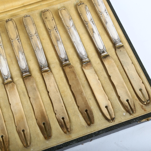 822 - A cased set of 12 French silver-handled knives, length 17cm, with original label