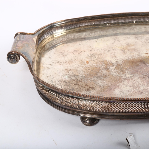 833 - A large 19th century Sheffield silver plate on copper tea tray, with scrolled handles, length 69cm