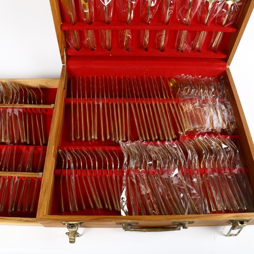 844 - A canteen of bronze cutlery for 12 people (142 pieces), in fitted case