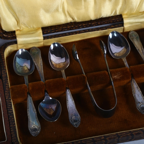 907 - A cased baby's silver spoon and food pusher, and a cased set of plated teaspoons and matching tongs