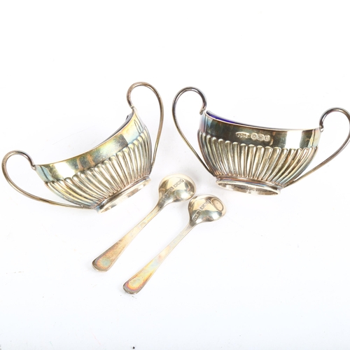 911 - A pair of Victorian silver half fluted salt cellars, with Bristol blue liners and spoons, Sheffield ... 