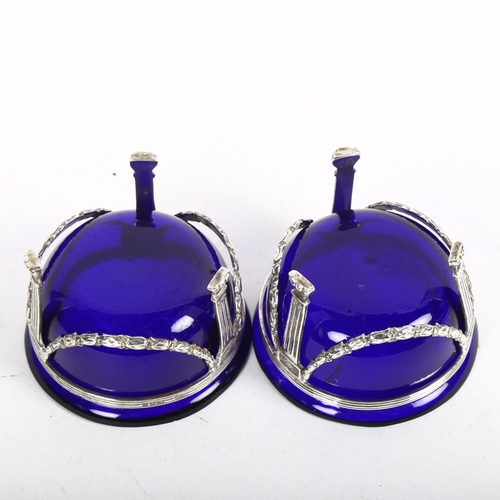 918 - A pair of Victorian Adams style silver salts, with floral swag decoration and blue glass liners