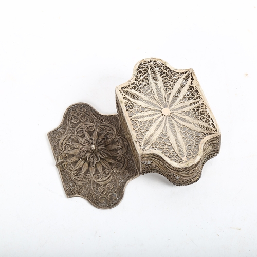 923 - A small Continental unmarked white metal filigree spice box, of shaped rectangular form with hinged ... 