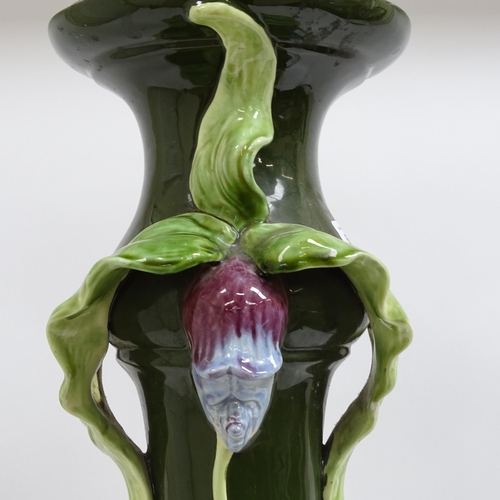 697 - A Continental Art Nouveau pottery jardiniere stand, with applied floral decoration, height 69cm